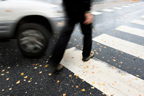 picture of blurry car hitting a pedestrian in a cross walk for the pedestrian injury page for Heintz & Becker, an injury law firm with offices in Bradenton & Sarasota, Flordia